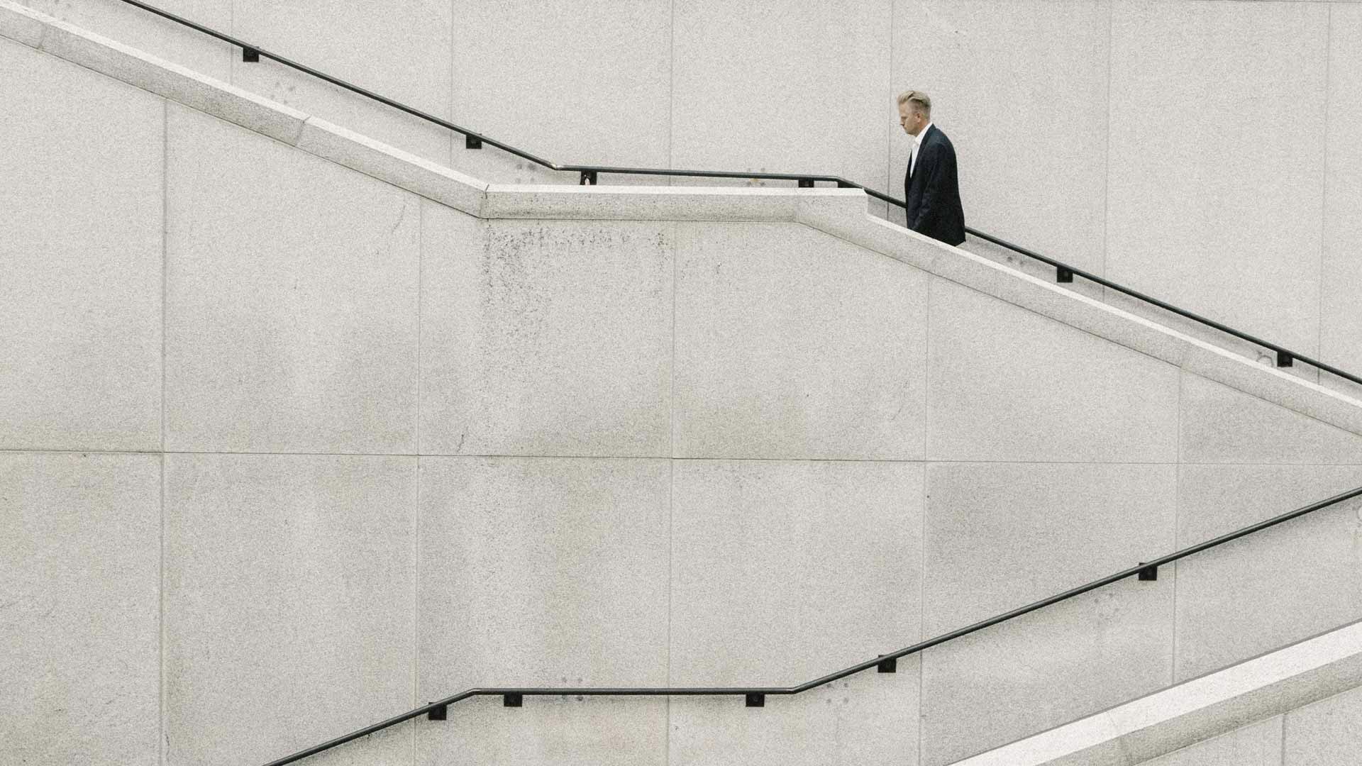 Businessman Walking Up Stairs